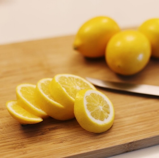 lemons sliced on a cutting board
