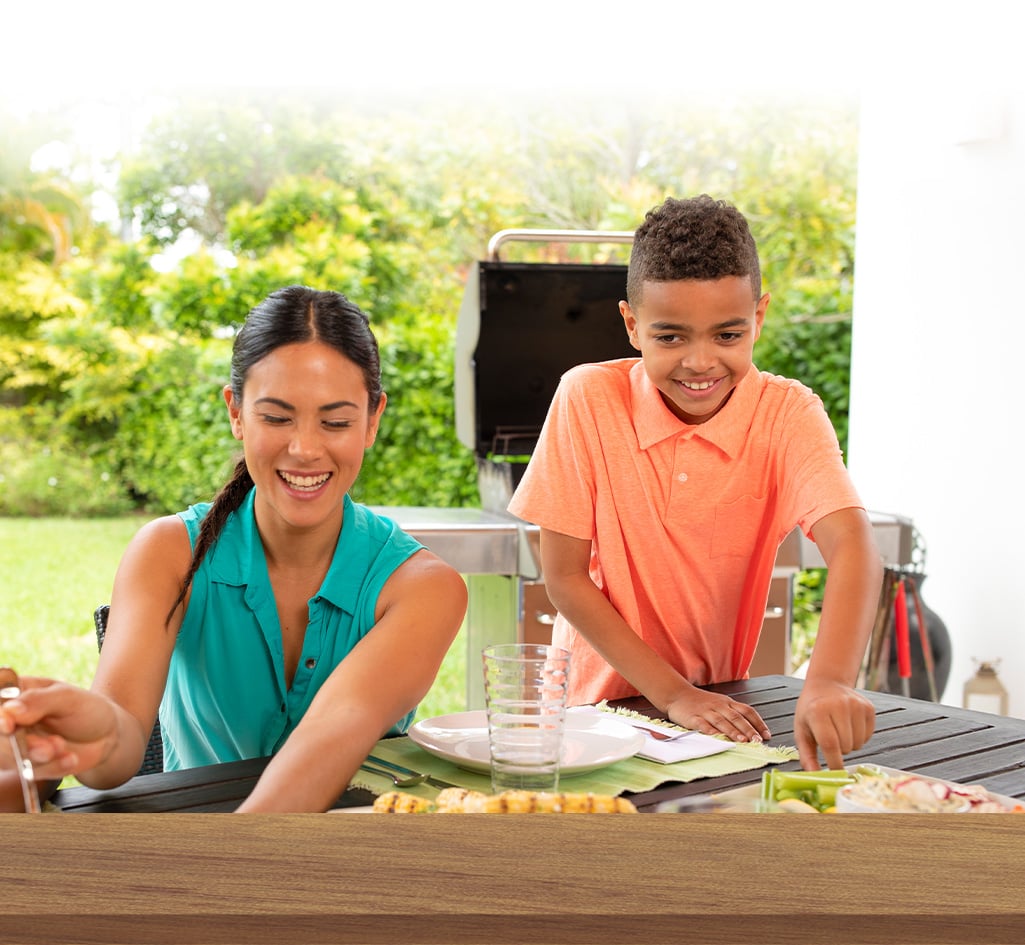 family enjoying a barbecue together