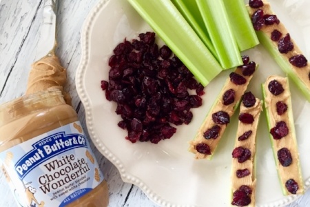 Celery with Peanut Butter and Co. White Chocolate Wonderful Peanut Butter and Dried Cranberries