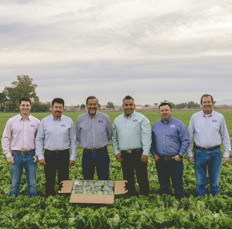 Duda team standing in the fields