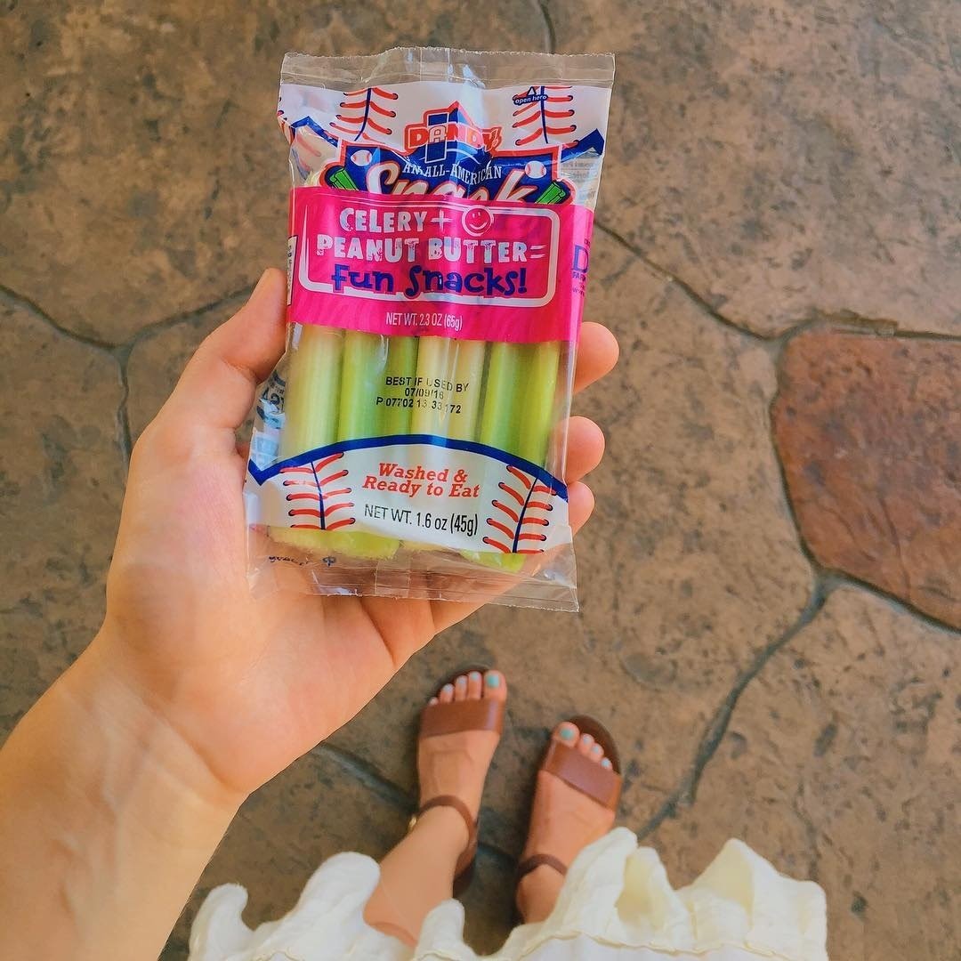 person holding a Dandy Celery and Peanut Butter Snack Pack